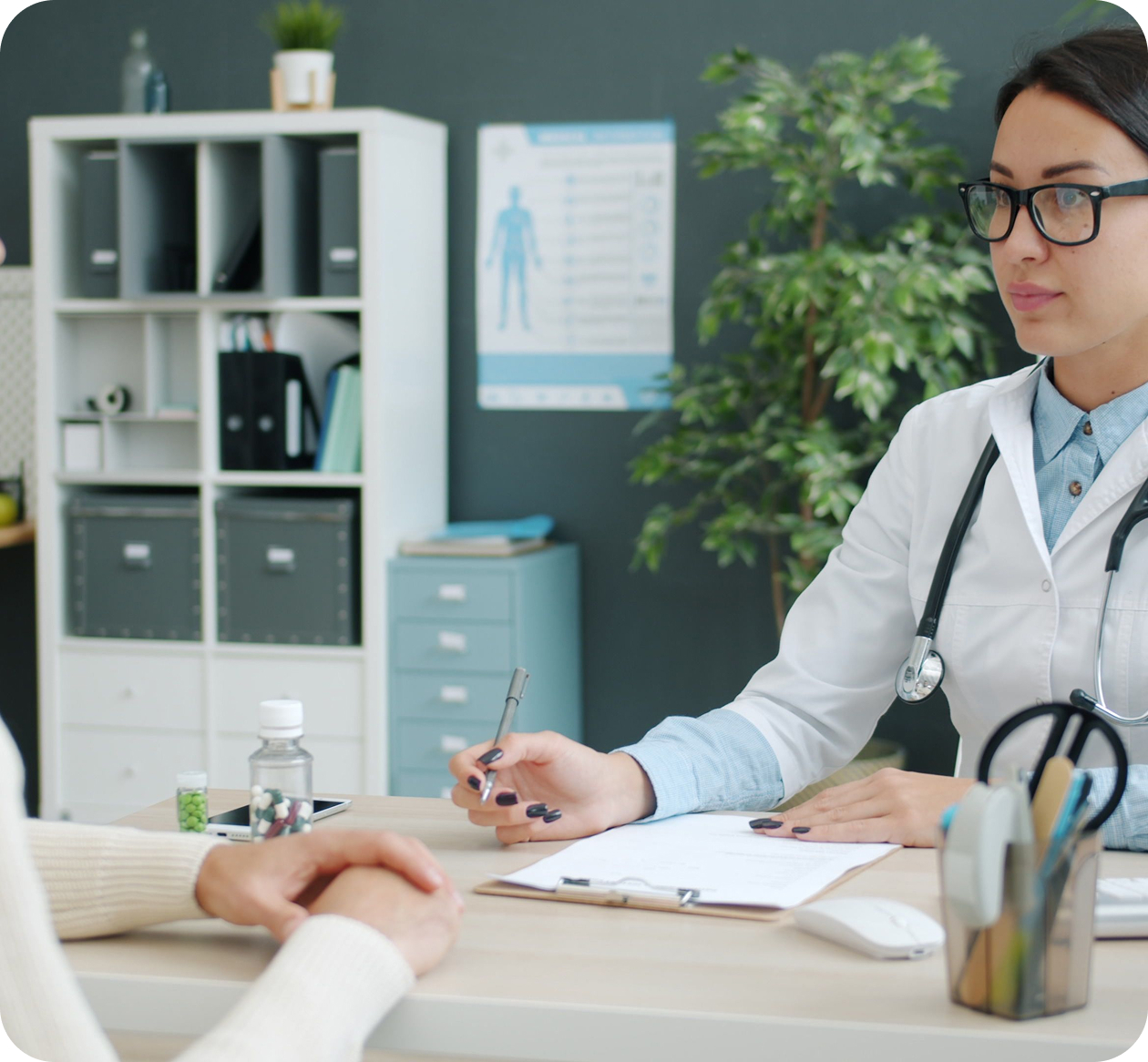DoctorAtDesk Medical provider talking to patient